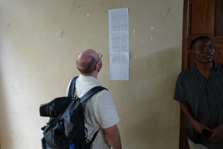 Volunteer participating in project planning and coordination with community leaders in Tanzania.